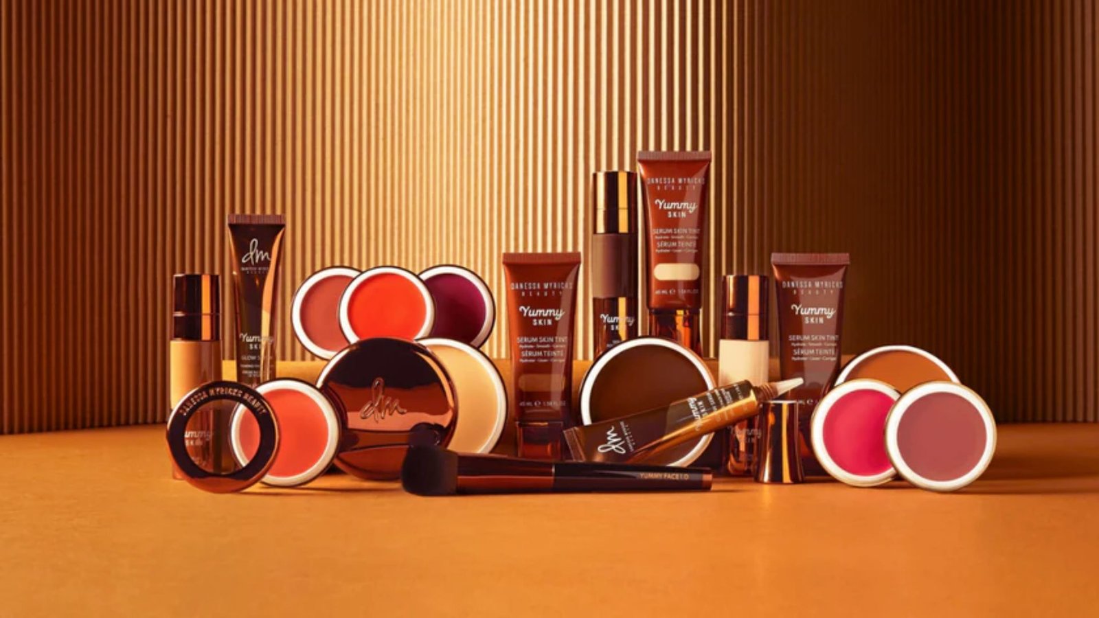  A variety of cosmetics and makeup products displayed together, including lipsticks, eyeshadows, and foundations.