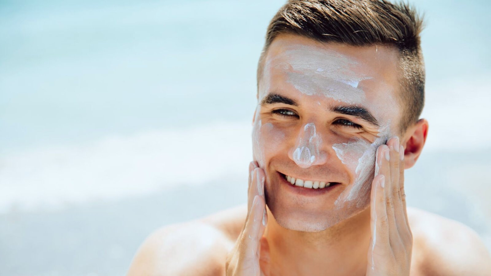 A man wearing a face mask, looking directly at the camera with a neutral expression.