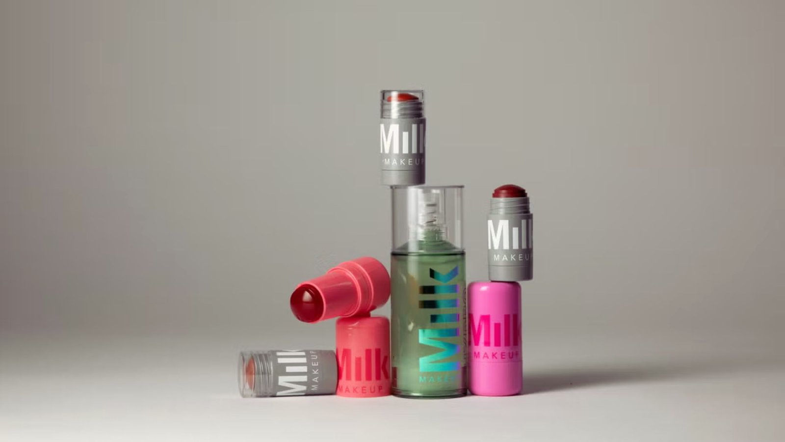  Multiple lipsticks displayed on a white background, showcasing different colors and styles.