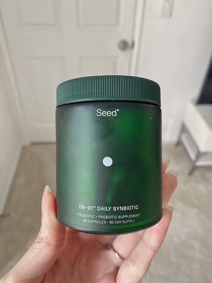 green glass jar of seed probiotic