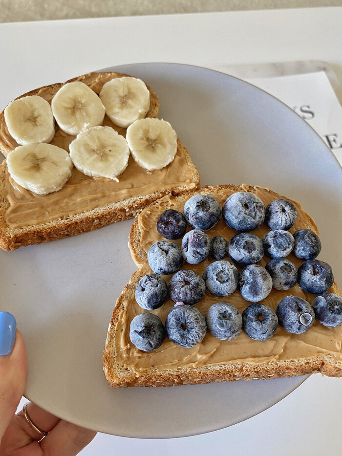 slices of toast with banana and blueberries