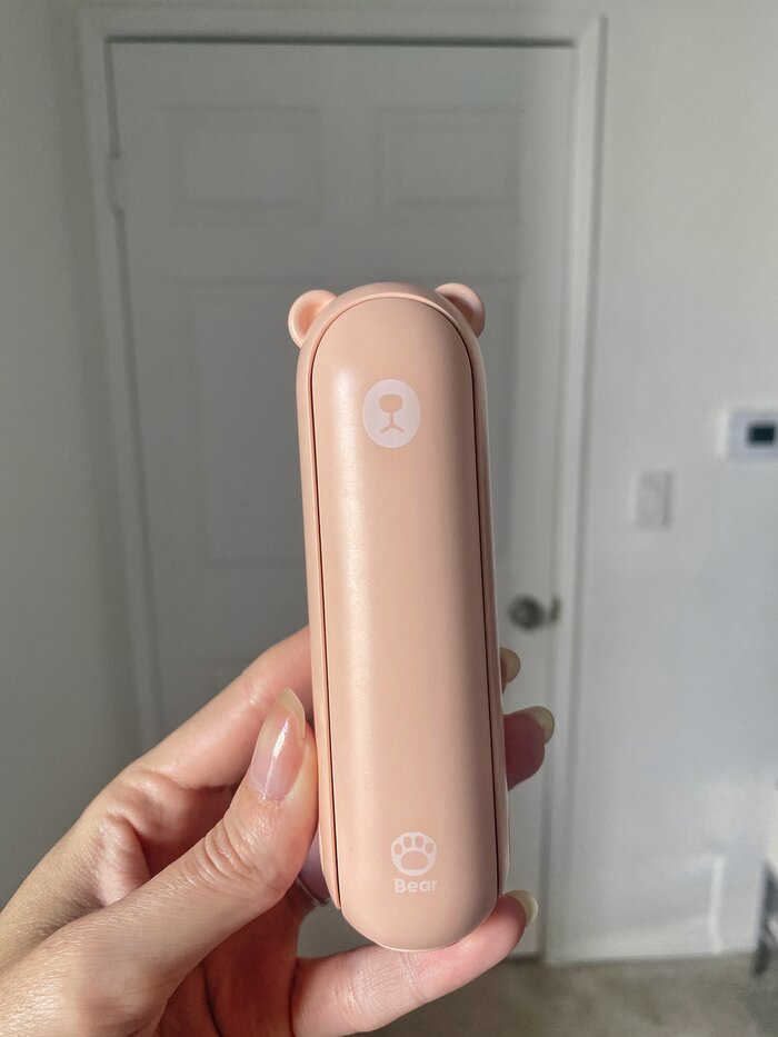 pink portable phone bank against white backdrop