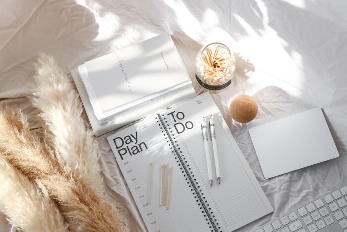 notepad and planner with pencils