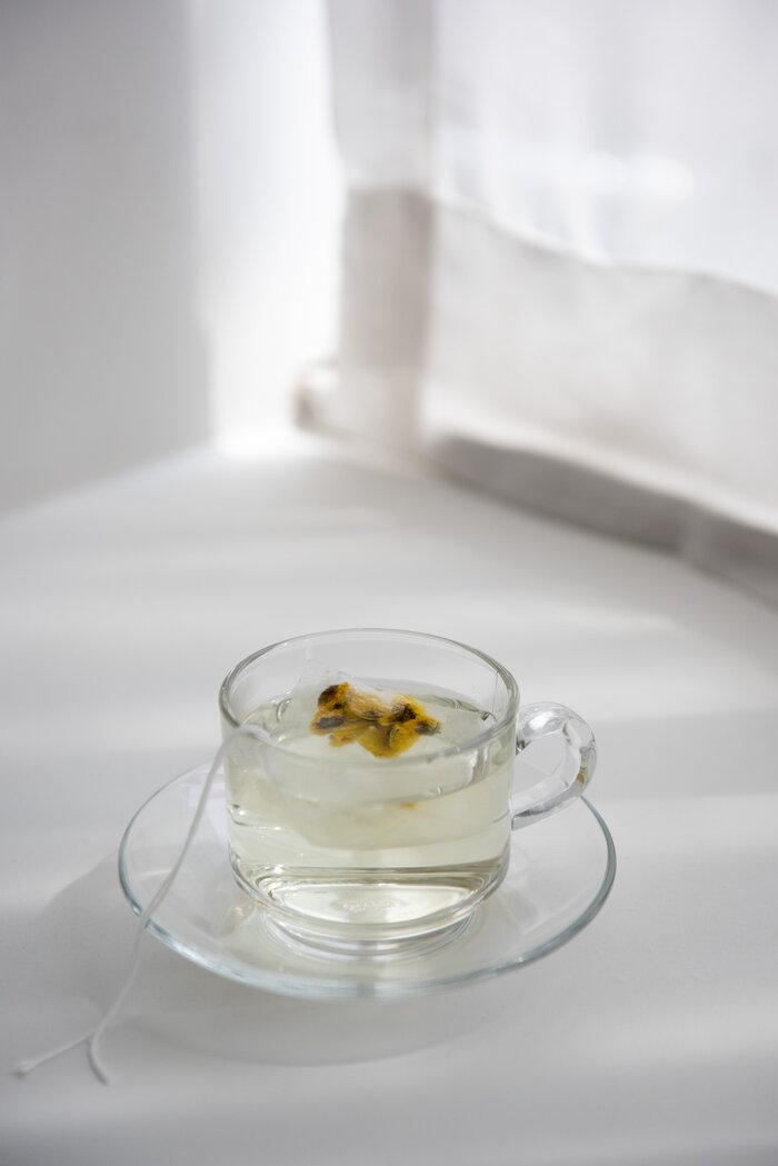 clear mug of calming chamomile tea