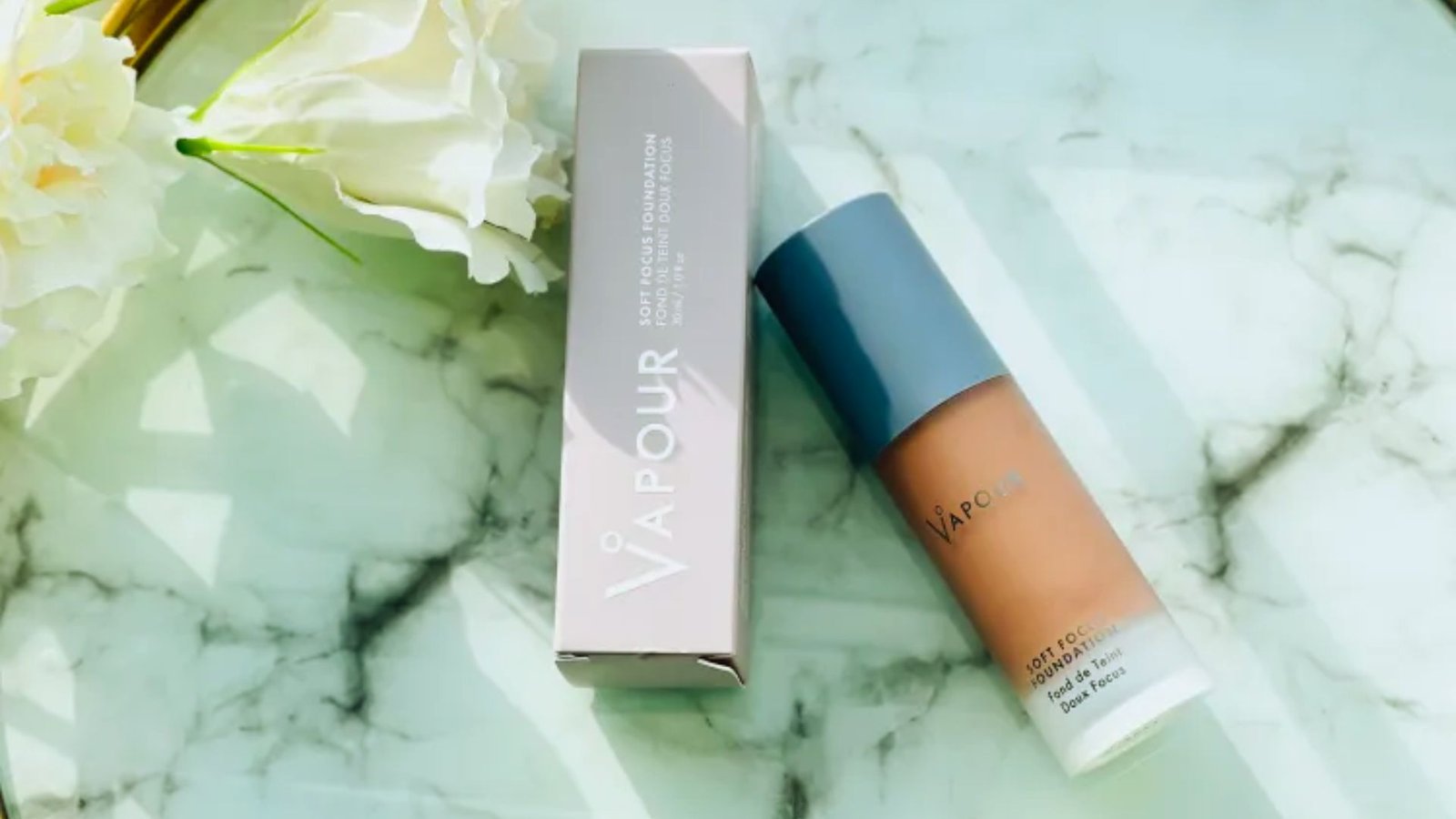 The Vivour Foundation is placed on a polished marble table, showcasing its elegant design and surroundings.