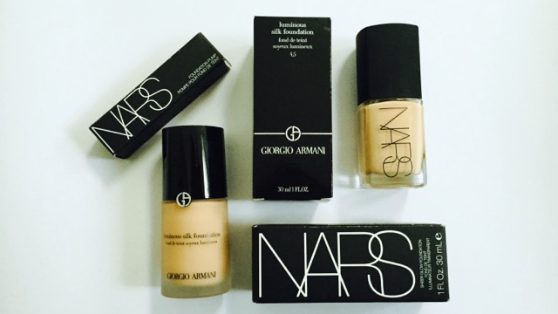 NARS foundation and concealer products displayed on a clean surface, showcasing their sleek packaging and shades.