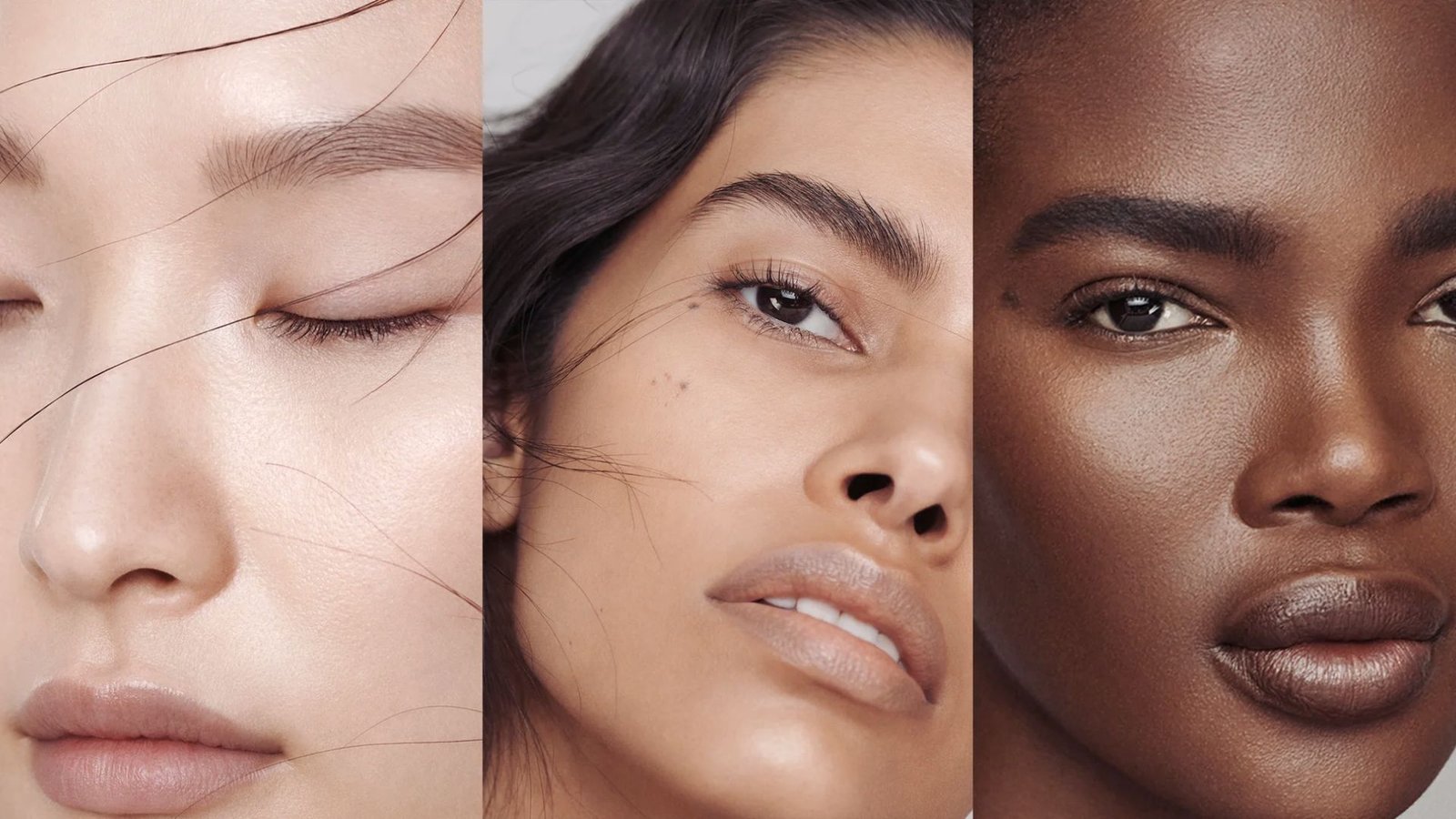 A collection of makeup brushes suitable for various skin types displayed on a vanity with soft lighting.