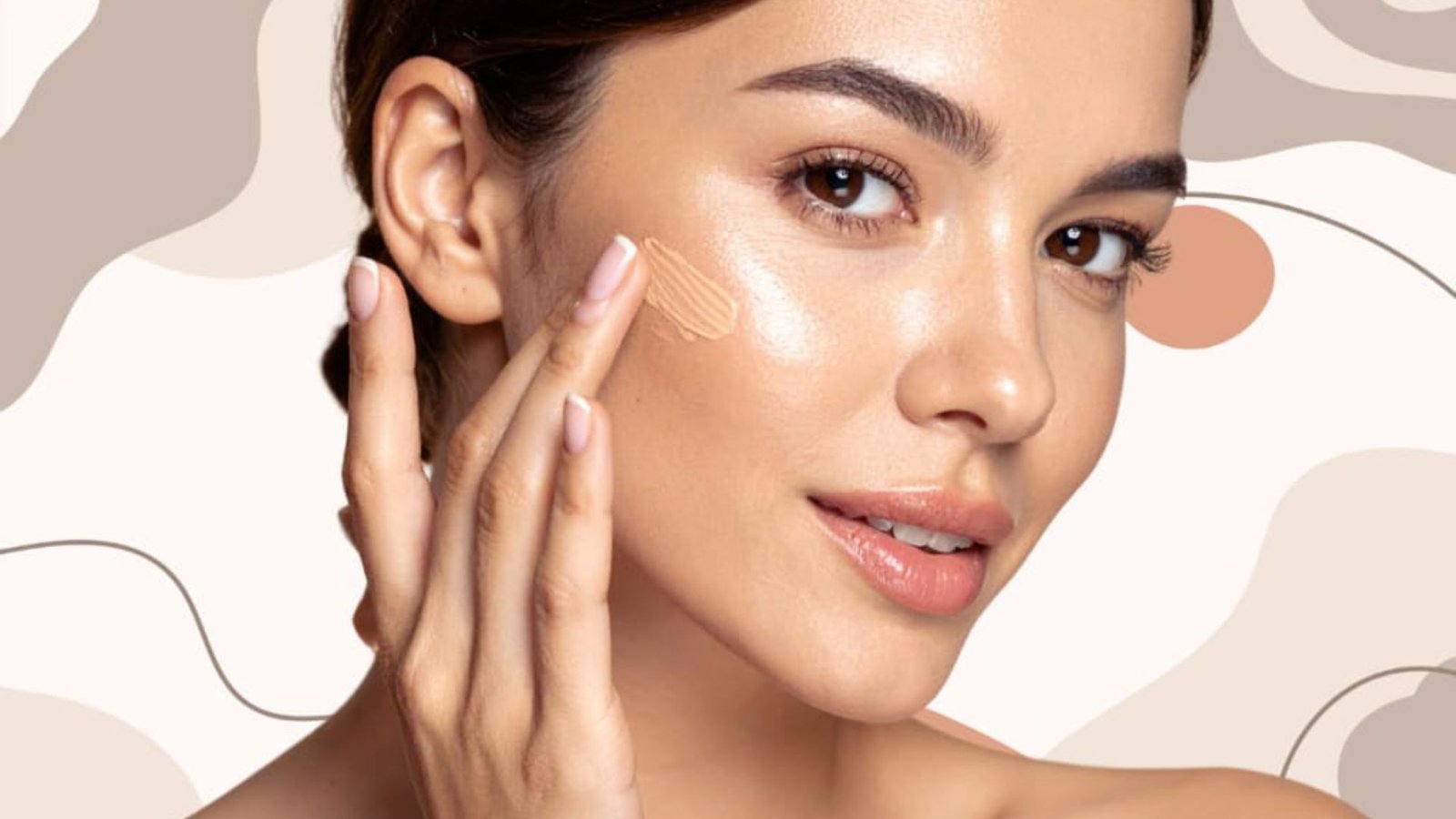 A woman applying cream foundation on her face, showcasing a smooth and even skin tone.